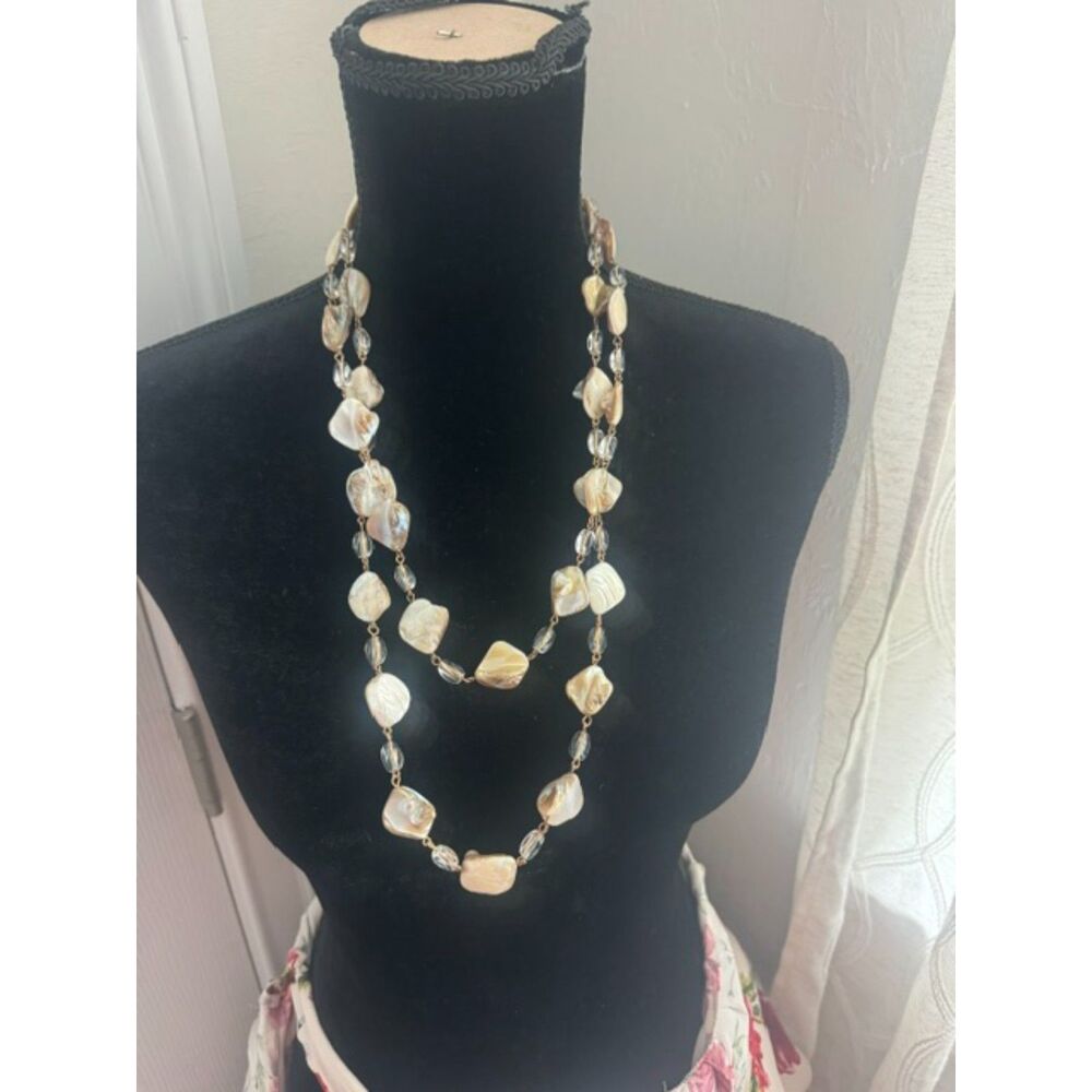 Long seashell necklace with glass beads.